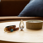Load image into Gallery viewer, memorial crystal sitting next to dog collar and candle
